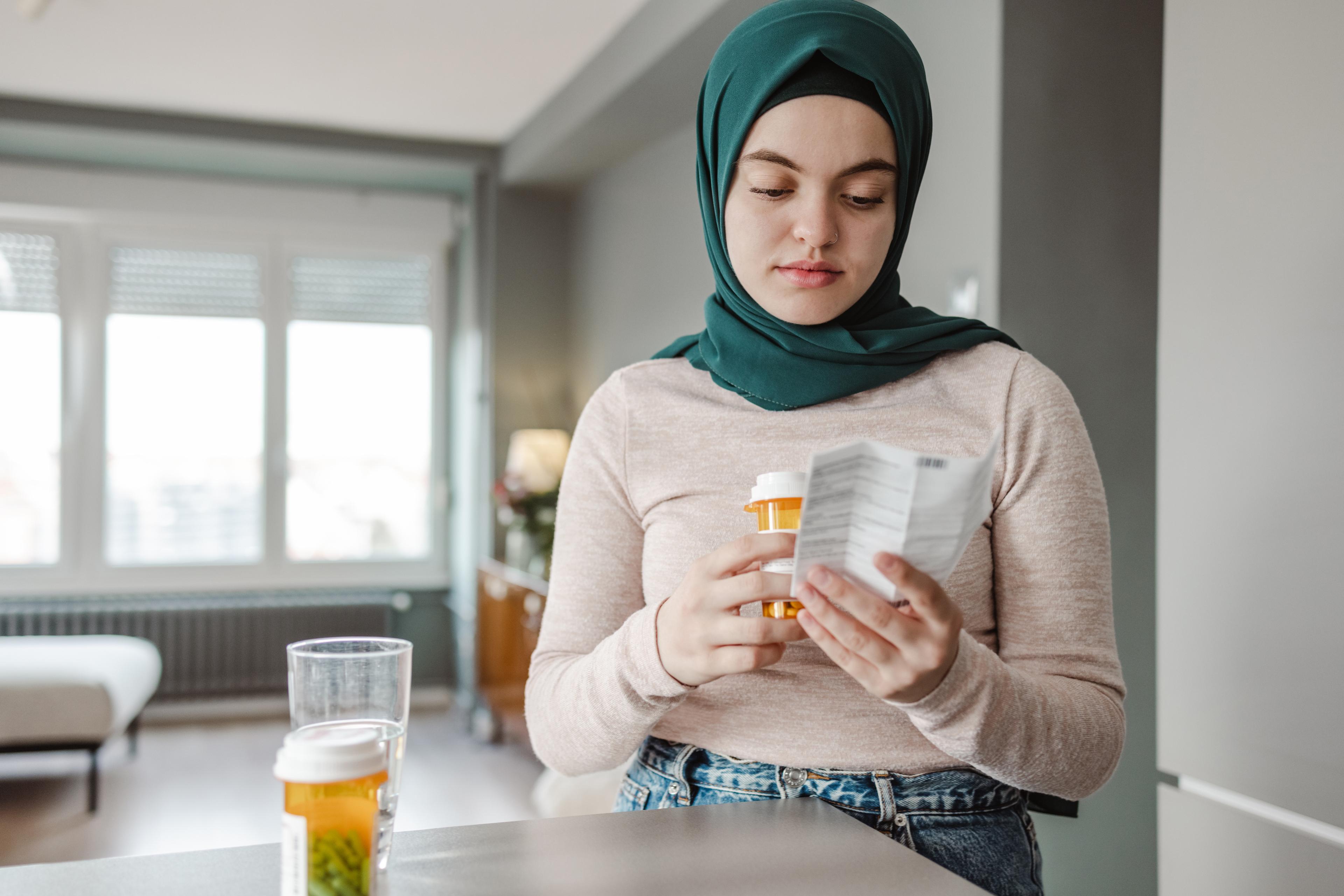 Woman reading prescription